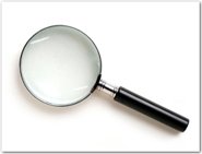 Magnifying glass with a black handle.