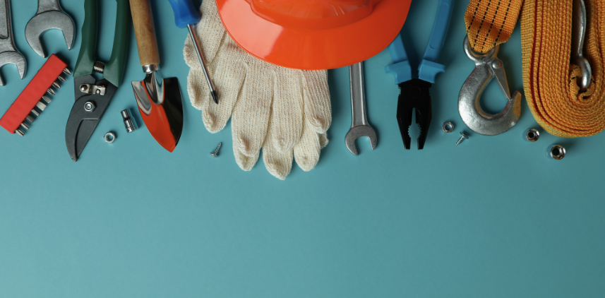 Various hand tools and protective equipment on a blue background.