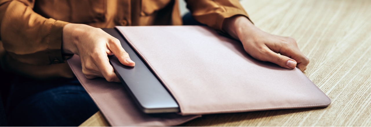 man gets laptop out of bag